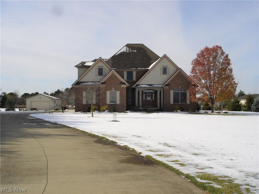 Stunning Custom Built Home with close to 5,000 Square Feet (Including Basement)! Featuring Four Bedrooms with a First Floor Master on over Two Acres! Oversized Master Bedroom Features  Vaulted Ceilings, Glamour Bath, Jacuzzi Tub and Large Walk-In Closet! Elegant Open and Airy Kitchen!  Beautiful Hardwood Floors, and Custom Cherry Cabinets!  Brand New Granite Countertops! Center Island and a Morning Room! Huge Great Room! Vaulted Ceilings, Fireplace with Mantel! Custom Built Wet Bar! Dining Room features Tray Ceiling and Chandelier! The Library/Office Custom Made Built-In Book Shelves and Plenty of Natural Light! The Dream 40x24 Outbuilding can hold at least 4 More Vehicles, is Fully Insulated, has 100 Amp Service, and Slat Walls around the whole Perimeter! An Aluminum Fence (No Maintenance) Surrounds the gorgeous Patio (Fountain Negotiable). Anderson Windows and Six-Panel Doors Throughout!  Full Partially Finished Basement with a seperate Workout Room! Pool Table Stays!! Large Storage Area and Glass Block Windows! Basement is Plumbed for a Full Bath! Home is Located on a Cul-De-Sac and Within Walking Distance to Buckeye School District! NO CITY TAXES! Home is Immaculate! Original Owner! Too Many Amenities to List!! A True Gem! Why Build When Everything Has Been Done For You?!!