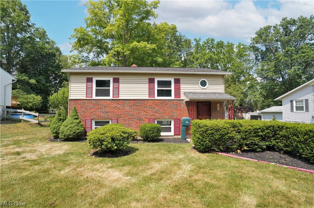 Buyers beware...Your spouse may disappear to the amazing 1,200 sqft, heat available, outbuilding, only to return for food or sleep! I marked it as a 4 car garage, but in all reality, it could hold more if opened up. Wait until you visit this entirely remodeled beauty in the heart of Stow! I could not stop smiling when I saw the amount of work they did to this home to get it ready for the new owners. The entire home has been remodeled in modern colors and trends. The upper level has a living room, 3 bedrooms and a full bathroom. The lower level has a massive eat in kitchen with cabinets galore! It also has a large family room and a separate laundry/utility room that has a door to go to the back yard. The roof and siding is estimated to be between 10-12 years, Furnace and air around 2016, water tank 2023, and rehab 2023. Windows are not original, but they don't know when they were replaced. This was the family home growing up and the kids had it rehabbed to sell. The outside​​‌​​​​‌​‌​​​‌‌​​​‌‌‌​​‌​​‌‌​​​​ building
