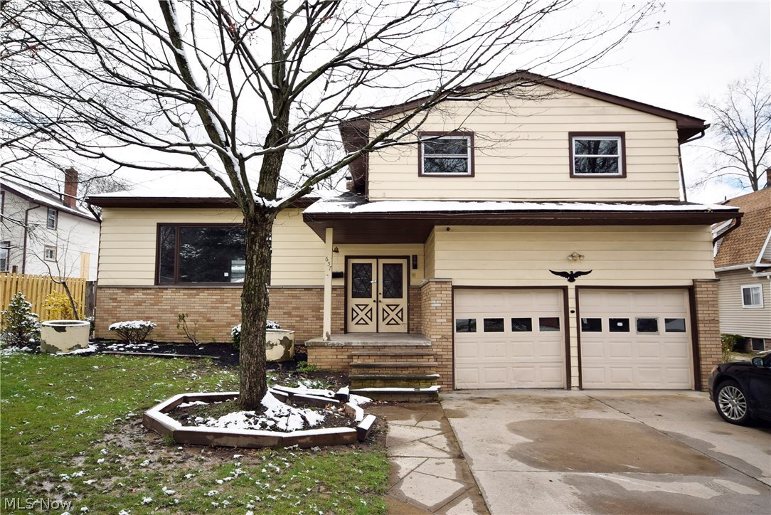 Look at this totally redone 4 level split! 4 bedroom, 2.5 baths. Large living room with beamed vaulted ceilings which opens to the dining room and the open staircases up and down. Wait until you see the open kitchen with an eat-in area that overlooks the lower family room which features a wood burner in the corner. Family room leads to an enclosed patio-16 x 20 to the back and a 2-car attached garage to the front. Large 10 x 20 shed in the backyard with privacy fence around perimeter. New carpets and fixtures throughout updated bathrooms and updated kitchen. Don't wait til this one is sold, call today to schedule your personal showing!