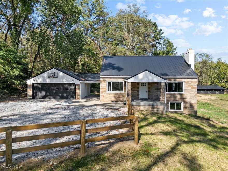 This home! This property! It’s clear so much thought and care went into this complete renovation. Before you even step inside, you’re greeted by a picturesque setting that instantly draws you in. Every structure on the 3.6-acre property has been refreshed with a new roof and a beautiful coat of paint. The main level is spacious and thoughtfully designed. You’ll enter into a kitchen straight out of a chef’s dream—complete with stainless steel appliances, including a 5-burner gas range. Expansive granite countertops offer plenty of room for cooking, baking, or entertaining. The open layout flows seamlessly into the living and dining areas, making gatherings easy and enjoyable. The primary suite overlooks the peaceful pasture and features a walk-in closet and a custom-designed bathroom. The tile work and finishes are stunning—truly designer-approved. The second full bath offers a shower/tub combo with matching tile for a cohesive look. An 8x10 laundry room, a dedicated office, and another bedroom with a walk-in closet complete the main floor. Upstairs you’ll find space that can serve as one or two additional bedrooms or the perfect hobby area. The lower level offers endless flexibility, currently featuring another bedroom and full bath—ideal after a day working outdoors. Outside, the property continues to impress. A six-stall barn with water hook-up is ready for your animals, and a second outbuilding provides ample storage for equipment or tools. There’s even a secondary driveway for added convenience. Everything here is truly turnkey—new flooring, fresh paint, updated lighting, trim, doors, and more. There’s nothing left to do but move in and enjoy. You have to see it to believe it—schedule your private showing today!