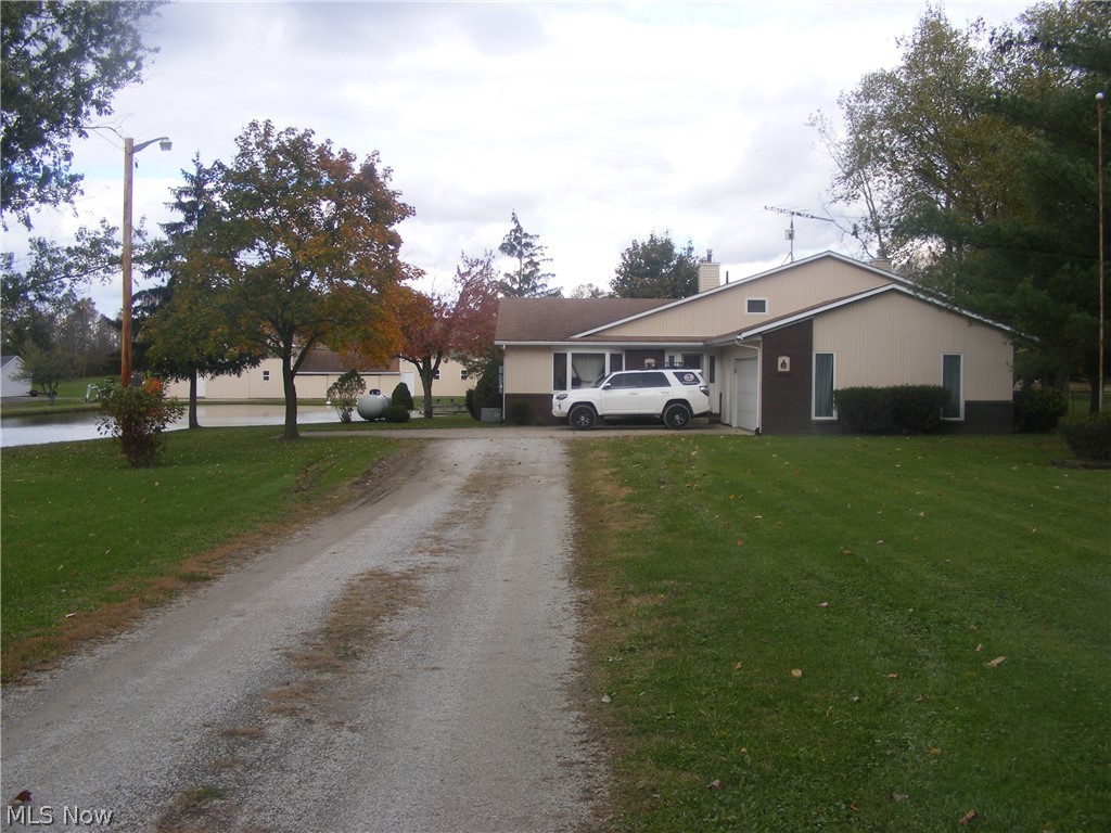 Fantastic Horse Property! This 4 bdrm/2 bth 4 level Split sits on 5 acres with an extra large pond and an amazing 7-8 stall horse barn, indoor riding arena, tack rm, furnace, water heater and storage areas. 36x80 pole barn attached. 60x120 Indoor arena has sprinkler system to keep dust down. 2 electric fenced pastures. Pond has dry hydrant. Home has whole house generator that self tests every two weeks. Fireplace in lower living rm set up for woodburner. First floor laundry has a lg shower stall, cabinets and opens to a covered 9x14 back porch, Upstairs bathroom features a jetted tub to soak in after your long days.