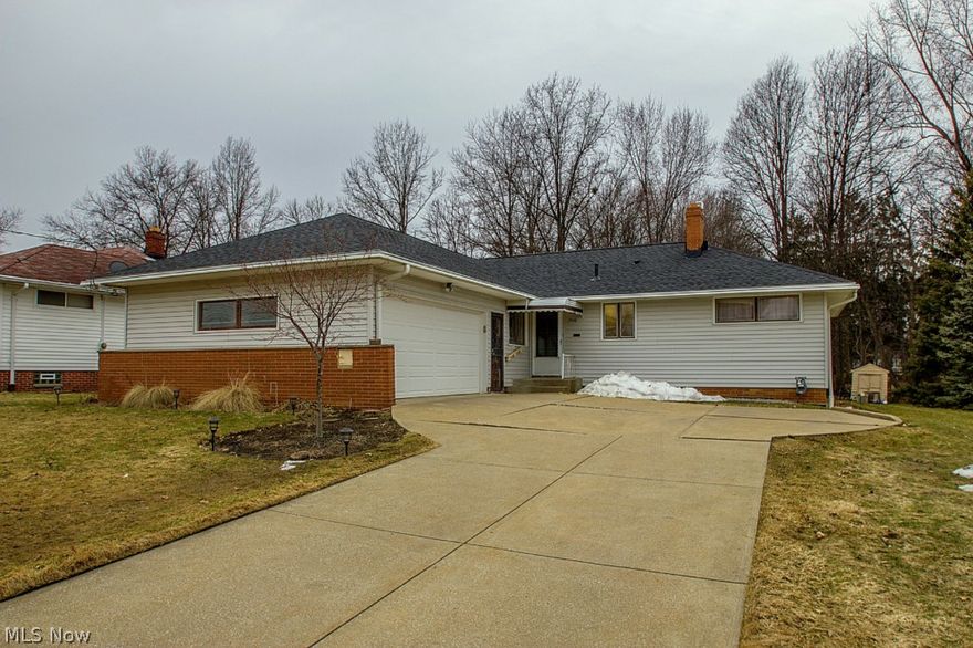 This fantastic Ranch has it all! Hardwood floors flow throughout the inviting foyer, formal dining room & large living room w/ cozy fireplace and wall of windows overlooking the private backyard! Amazing remodeled kitchen w/ every upgrade imaginable, including stainless steel appliances, center island w/ breakfast bar & soft close, solid wood cabinets & drawers! 3 generously sized bedrooms, beautifully updated full bath & convenient powder room complete the main level. The lower level has been completely waterproofed and offers a partially finished recreation room w/ fireplace, separate workshop & laundry room w/ huge utility tub & new washer & dryer. Other great features include an attached 2 car garage, new roof (2014) and oversized lot w/ 2 conjoined patios, firepit, storage shed & private wooded view! A must see home!