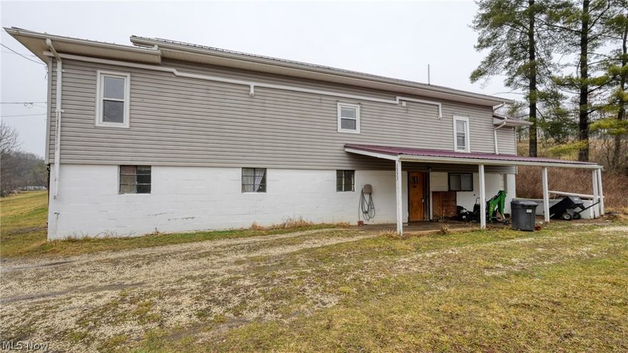 Opportunity awaits with this unique raised ranch home situated on 4.19 acres between Cambridge and New Concord. The layout offers excellent potential for a duplex conversion or multi-generational living, featuring living spaces on both levels with kitchens, bedrooms, and bathrooms on each floor. The upper level includes a comfortable living area, kitchen with breakfast bar and laminate counters, bedroom, and full bath with laundry hook-ups. The lower level provides additional living space with a second kitchen, bedroom, bath, and laundry area—making it ideal for an investment opportunity, rental potential, or separate guest quarters. Outside, enjoy the privacy and versatility of over 4 acres with a mix of open and wooded land, along with a pole barn for additional storage, workshop space, or hobby use. The lower level does need some TLC, giving buyers the chance to update and customize the space to their needs. The heating/air are TopLine Split Systems. Property is being sold AS IS, making it a great opportunity for investors, renovators, or buyers looking to build equity. Whether you're searching for a country home, investment property, or a project with potential, this property offers space, flexibility, and possibilities.