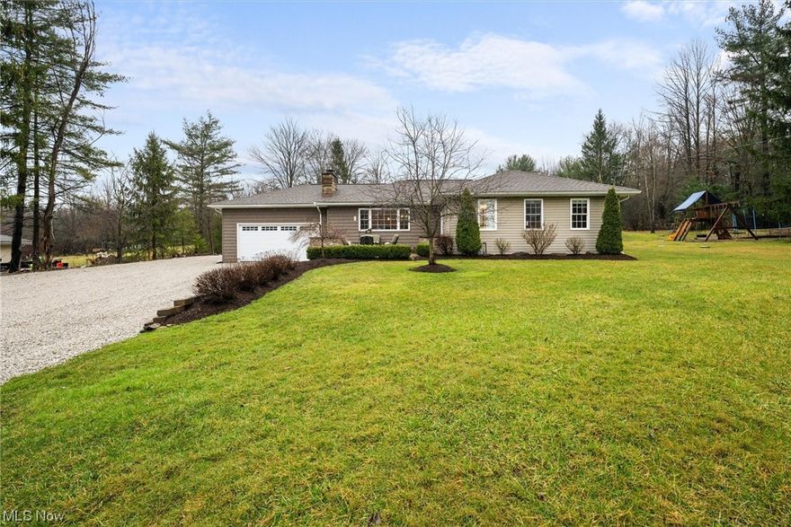 Don't miss out on this extraordinary opportunity to call this stunning home your own, nestled on a sprawling 4 acre parcel of land boasting 3,000 Sq Ft of meticulously crafted living space. From the moment you arrive, the charming paver patio and impeccable curb appeal invite you in. Discover an open floor plan designed to cater to all your entertainment desires. The spacious and luminous living room captivates with its vaulted ceiling and elegant ceiling beams and with access to the serene rear patio. For the culinary enthusiast, the chef's dream kitchen awaits, featuring an abundance of exquisite cabinets, sleek granite countertops, a stylish ceramic backsplash, a convenient breakfast bar, a generously sized pantry, and stainless-steel appliances, all included. Adjacent, the dining room offers a picturesque view through its large window, complemented by a cozy wood-burning fireplace. Retreat to the owner's suite with a generous closet and direct access to a full bath boasting a walk-in shower and a vanity with ample storage space. Two additional bedrooms with closet space and a full bath with a tub featuring ceramic tile surround complete the main level, along with a conveniently located laundry closet just off the kitchen. Venture downstairs to discover the ultimate entertainment zone in the finished recreation area, illuminated by large windows. An additional versatile room awaits, perfect for a craft room or a home office; an additional storage area completes this level. Outside, savor tranquil summer evenings on the rear patio, or indulge your green thumb in the fenced-in gardening area. The sizable insulated and heated barn with two post lifts offers the ideal space for car enthusiasts or housing your prized tool collection. Attached two-car garage. Recent updates include Rheem on demand 9.5 gas water heater 2022 basement finished with 2 egress windows 2020. Take advantage of this remarkable opportunity to claim this exceptional property as your forever home.