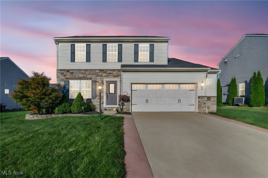 (4k Video tour) Elegant & dramatic—Stunning home w/premium upgrades is a true showcase of pride of ownership, situated in the highly sought-after Shale Creek Golf Course community. No expense was spared in creating an upgraded, refined living experience where every detail shines. Premium elevation features a partial stone front, an expanded colored concrete driveway, & a fully fenced backyard complete w/stamped & colored concrete patio, perfect for summer entertaining. Inside, 9-foot ceilings & walls of windows fill the home w/natural light, while durable, stylish luxury vinyl plank flooring has replaced all carpeting for a seamless, modern look. Breathtaking kitchen is truly one of a kind, boasting custom glazed solid maple cabinets, premium Cambria quartz counters w/two breakfast bars, glass tile backsplash, & high-end hardware plus can lights. Stainless appliances, a walk-in pantry with custom organizers and a glass door, plus an open morning room w/backyard views make this space a chef’s delight. The inviting family room with a romantic fireplace offers the perfect gathering spot, while the remodeled half bath with glass vessel sink adds sophistication for guests. Upstairs, the owner’s suite pampers w/walk-in closet, comfort-height vanity, and a private bath w/garden tub. Spacious secondary bedrooms provide room for all. Added touches include a first-floor laundry with frosted glass barn door and custom convenient cabinetry, extensive trim detail, upgraded fixtures including waterfall faucet & custom blinds throughout. Deep open basement, already plumbed for a future bath, offers endless expansion potential. Upgraded “Florence” floor plan is complete inside &  out—an affordable luxury in a golf course community you’ll love & located in York Township w/no city income tax. Access to pool & fitness.