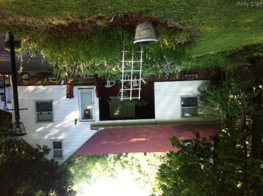 Country living in the City! 8/10ths of an acre!  Beautifully landscaped and nestled into the hillside!  Lovely 4 bedroom 2 bath bungalow with loads of charm!
Formal dining room leads out to beautiful backyard with patio!  Living room with woodburning fireplace!  Kitchen with all appliances and a bay window for your flowers or herbs!  Hardwood flooring throughout!  Full basement with washer and dryer!  Oversized 2 car garage with opener!  Skylights and second floor porch for that early morning cup of joe! Already inspected and City of Euclid violation free!!!