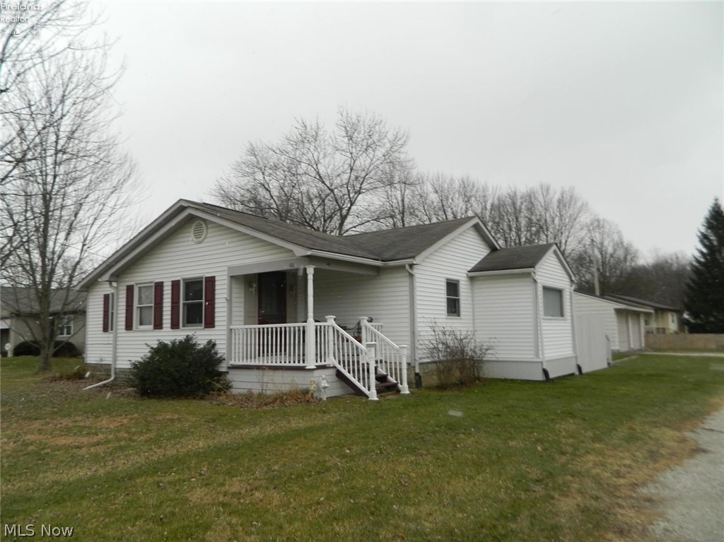 A cozy ranch situated on a corner lot- This could be the perfect home for you! This 4 bedroom house features a large deck off the back as well as a two car garage. A large living area with exposed beams and wood flooring flowing throughout make a great space for entertaining company. A separate laundry area and fresh paint are just a few extras this home has that make it completely move in ready!