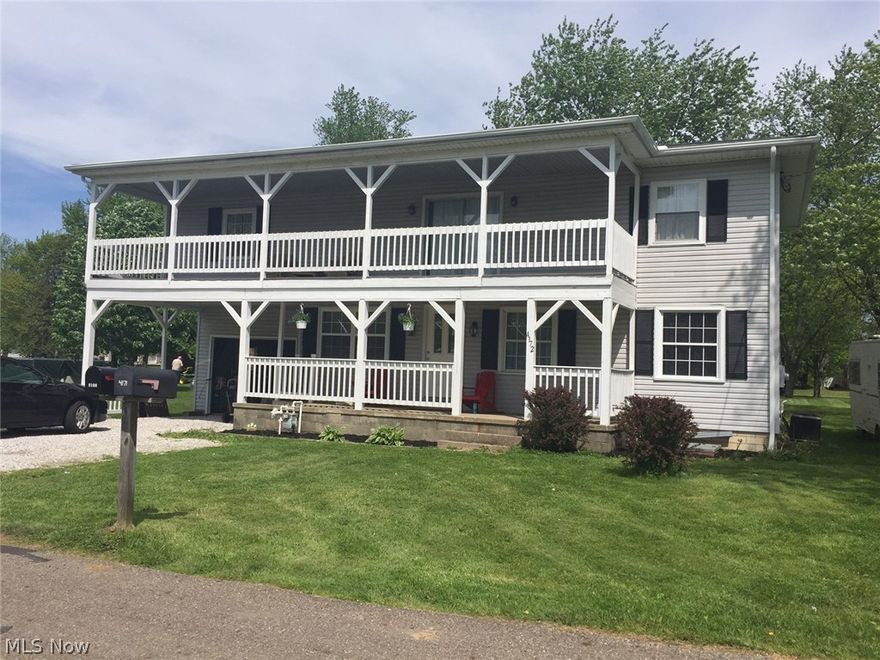 More pictures coming !Don't miss out on this extremely lovely large 2 living rooms, 4 bedroom, 2 full bath home on two lots in Louisville School District.  New privacy fence on south side.  County sewer, carport, garage, complete upper carpeted balcony, lower porch, back deck, large living room down and another upstairs.  Master bedroom on first floor has access to first floor bath, which is accessible to rest of the first floor.  Master bedroom has patio doors opened to your own tiered deck.  This home was totally rehabbed from top to bottom between 2012 and 2014.  Mostly new windows, all new flooring, partial new roof, all new kitchen, porcelain countertops, fixtures, lights, new central heat and air, new woodwork throughout, new doors, wiring, plumbing, etc.  All new baths with a beautiful large shower upstairs in bath in 2015.  June 2016 all seamless gutters and downspouts with leaf guards.  Open floor plan on first floor sports a staircase to a whole new world upstairs, with large