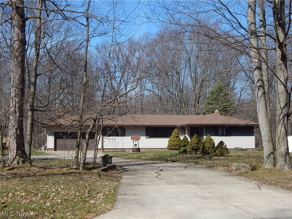 Opportunity knocks for this One Owner, Custom Built, Mid Century Ranch on Approximately 1 Acre wooded Paradise! Enjoy Nature & Country views, yet be within moments of Vibrant Crocker Park and nearby amenities. Let the Oversized Foyer draw you in to enjoy all the Move In Ready Features. Freshly Painted thruout with newer flooring and carpeting, & light fixtures, with an Open and Airy Floor Plan,
Onyx hued New Countertops enhance one of the nicest Country Kitchens you'll ever see. New 2018 Stainless Appliances are Refrifgerator, Microwave, Dishwasher & Disposal. Ceramic Floors & Loads of Storage with the Built in Pantry Wall. All new down to studs is the Half Bath in this area. Stunning White stacked Stone wall is a feature of the adjoining Family Room with Front and Back Picture Windows to soak up the view. Andersen Windows are thruout the home. Updated Main Bath has tub and separate shower stall. 3 Roomy bdrms. have new paint, lights & carpeting. Updates for 2018 include: Electric