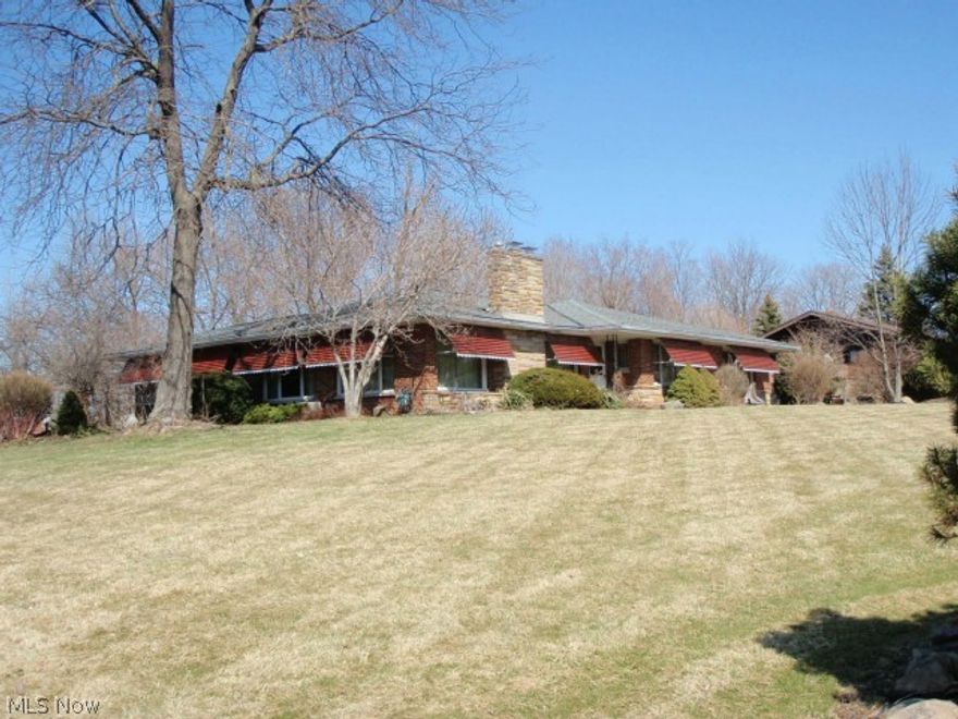 Large sprawling brick ranch with full basement with in law suite.    Spacious formal living room with fireplace, and dining room. Full wall windows.  Many built ins. plus cedar closet on main floor.  Office, laundry room on first floor.    First floor is 2104 sq ft.  Basement is 1727 sq feet. In law area has full kitchen with appliances, 2 bedrooms,  living room and full bath.  2 Barns, pond, acreage. Built in pool needs repair-has not been used in years.