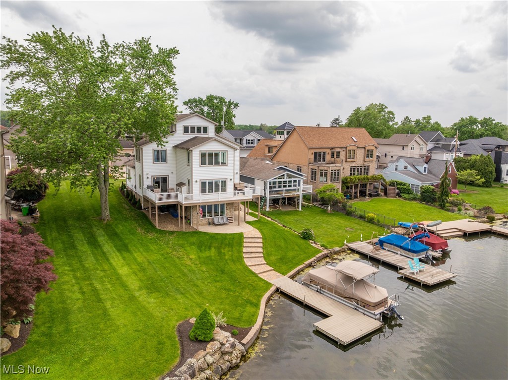 *OPEN SUNDAY, 8/3 FROM 2-4PM*
Lake life awaits! This home offers you a true lake lifestyle on one of the largest, most desirable parts of Lake Cable and includes a beautiful pontoon boat. Wake up to tranquil water views and morning sun at this stunning 3-story, 3-bedroom, 3.5-bath waterfront residence. The open main level features cathedral ceilings, hardwood floors, a spacious great room with a gas fireplace, and a well-appointed kitchen with white cabinetry, granite countertops, stainless steel appliances. A wet bar and expansive dining area complete the layout, ideal for entertaining. A large deck overlooks the water and private dock. Outdoor amenities include a gas grill and a large concrete area providing ample parking for family and guests. The primary suite offers a cozy gas fireplace, spa-like bath with heated tile floors, a sauna shower, and a generous walk-in closet. The third-floor suite provides a peaceful retreat with beautiful lake views and a private full bath. The main floor also features a flexible room currently used as an office and features custom-built office furniture that remains with the home. Office could easily function as a den or additional bedroom if needed. The walk-out lower level is designed for both relaxation and functionality offering an open living space with a fireplace with a beautiful view of the lake, a spacious bedroom with a full bathroom, a separate large storage area and direct access to a spacious lakefront lot and private boat dock. Additional highlights include 2 car garage with slip resistant epoxy-coated garage floor, central vacuum, radon mitigation system, security system, day/night shades, laundry room with 1 year old washer and dryer. Home offers comfort, premium features, and a lifestyle many dream of. As part of the Lake Cable Recreation Association, you’ll enjoy access to the clubhouse, marina, boating and firework display. A must-see for anyone looking to live the ultimate waterfront lifestyle.