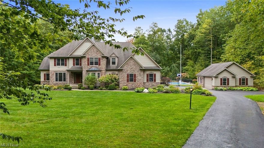 WELCOME HOME to this Stunning Custom Built Colonial by Payne & Payne nestled on 6.8+Private Wooded Acres! This beautifully updated and spacious home boasts over 4500 finished sqft of living space with 4 Bedrooms, 4.5 Baths, freshly painted interior and gorgeous hardwood floors throughout first level. Foyer entrance welcomes you to Dining Room & 1st floor Home Office. Bright and light 2-story Great Room has a wall of windows & floor-to-ceiling fireplace wall flanked by built-in cabinetry & bookshelves. Gourmet Kitchen with new quartz counters, center island with built-in microwave, breakfast bar, pantry, stainless steel appliances include double oven & gas cooktop, ceramic flooring & Dining area with french doors to 3-Season Sunroom with new Pella windows. Retreat to the 1st floor vaulted Master Bedroom Suite with hickory wood floors, customized walk-in closet & Remodeled Master Bath with double sink vanity & oversized tile/glass shower. Second floor includes Loft area overlooking the Great Room, 2nd Master Bedroom with private bath & walk-in closet plus 2 additional spacious bedrooms with jack-n-jill bath. 1st floor Laundry Room & Mudroom with built-in bench and shelving. Full finished lower level includes Rec/Media/Play Room with all new LVT flooring, Wine Room, Full Bath and generous storage. New gas Furnace & A/C installed 2022. Enjoy entertaining this Summer in the incredible outdoor oasis complete with fenced in-ground pool, newer composite decking, expansive blue stone patio with built-in fireplace/chimney, firepit with stone wall seating, built-in gas grill & kids play set stays! Situated on quiet cul-de-sac lot, this home is surrounded by mature trees with professionally landscaped yard and manicured beds full of lush plantings. Paved drive with turn-around, 3+car attached garage plus 32x24 detached garage. Ideal home for the growing family....Must see to appreciate all this home has to offer inside & out!