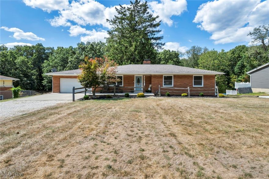Welcome home to 1369 S Polen Ave., a gorgeous 3 bedroom, 2 full bath all brick ranch sitting on 0.72 acres in Suffield! When you pull in, you will be blown away with the curb appeal this home offers with fresh landscaping and a large front porch. Inside, you will be greeted with a great living room featuring a picture window, pouring in natural light and a built in electric fireplace. The eat-in kitchen features newer luxury vinyl floors, white shake style cabinetry, stainless steel appliances and an abundance of cabinet space. A door off the eating area gives access to your private fully fenced-in backyard, concrete patio and 2 car attached garage. Down the hall you will find a large bathroom and 3 bedrooms all great in size! Downstairs is a great open area ready for your finishing touches! A workout room, full bath, storage space and laundry area complete this lower level. Updates include new hot water tank 2018, roof roughly 8-13 years old, furnace/AC 2005 and more! Located close to highway access, shopping, restaurants and more! Call today to schedule your private showing. This one is priced to SELL!