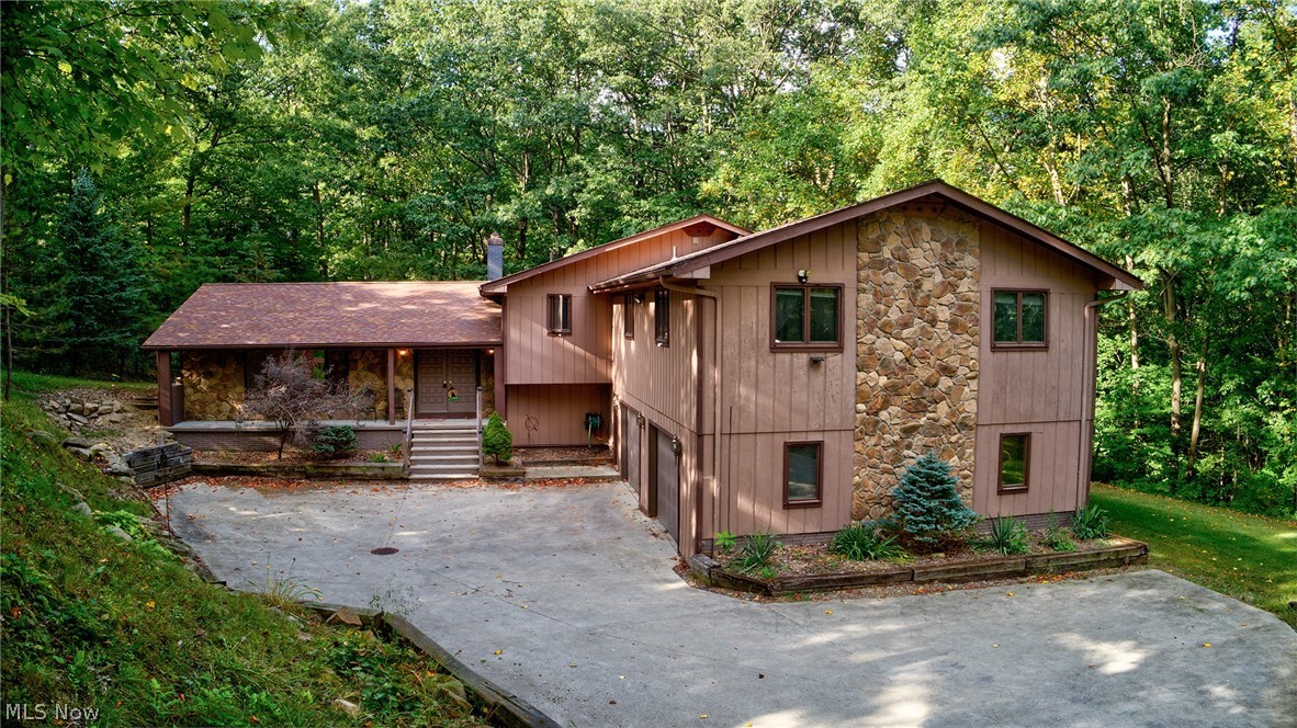 PERFECT FOR LARGE FAMILIES! Spacious home in the Highland school district! Located on a beautiful 2.8 acre lot Near the Hinckley Reservation. This home has many updates including new roof 2014, water softener, lighting, painting, stainless double ovens (2019) and drinking filter 2014. Newer carpet in much of the home, manufactured dark hardwood in office and gray wood in billiard room. Enjoy the wooded views from the family room while sitting in front of the natural gas fireplace. Also, enjoy a morning cup of coffee while relaxing on the private deck off the master suite. The property also includes a 25 ft suspension bridge over a creek, an elevated cedar hunting blind, gazebo, RV pad, and storage shed. There are endless possibilities with all the rooms and space this home has to offer, so bring your creativity! There is much more to see in this park like setting! The garage is over-sized (2.5 car) and also has a full bath. Peace and serenity awaits in this secluded home!