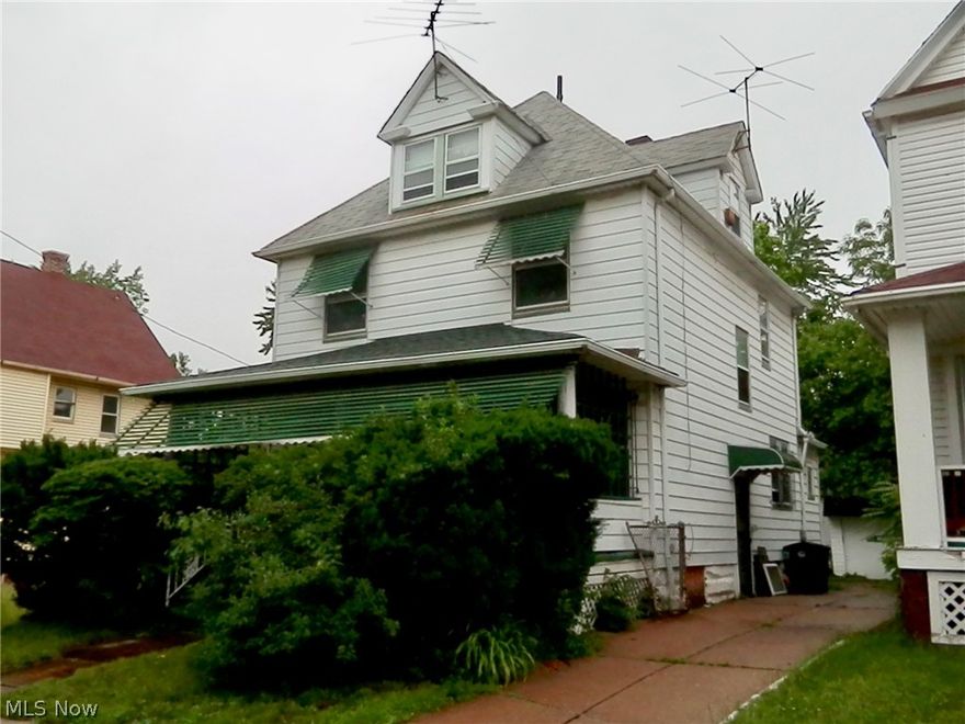 Large Aluminum sided, 4 bedroom home just off of Superior Ave on a One Way Street.  Fresh Paint and new carpet/vinyl flooring throughout the entire house.  Bath remodeled with new floor, toilet, sink and tub surround.  Kitchen has new flooring and splash guard.  New Electrical wiring and Fuse box in the basement. Home also features a large front porch and an extra room on the first floor that would have served as a Parlor when the home was originally build in 1912. Garage(with garage door opener untested) is actually a 1 1/2 car garage with extra storage or work room.  Home has both front and side security doors in addition to security bars on all the first level windows.  Bonus.... This home comes with (installed) an Acorn Curve 180 Stairlift system (untested).  Excellent Opportunity for an Investor or Owner Occupant.  Close to University Hospital, Cleveland Clinic, Case Western Reserve University, and University Circle area. Home sold "As is".  Seller to make no repairs