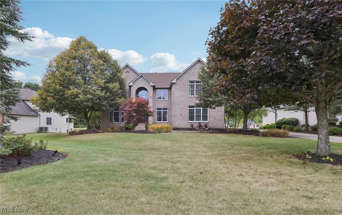 Your new dream home awaits with this 5 BR / 4.5BA Colonial in Hinckley's prestigious Wakefield Run neighborhood. As you enter, you are greeted by a fabulous two-story foyer w/ hardwood floors, adjacent living/parlor room, formal dining, and office. The spacious Great Room is open to the Kitchen and has a wall of windows overlooking the serene outdoors with plenty of natural light and features a stone front gas fireplace with mantle. The gourmet Kitchen is ideal for everyday living and entertaining, featuring corian counters, black appliances, island with breakfast bar, desk, and casual dining area. From the Kitchen, sliding doors lead to an outdoor deck with steps to a second lower level patio - perfect for grilling and relaxing. Main floor has a guest/additional 5th bedroom with adjacent sitting room and full bathroom. Spacious first floor Laundry Room and guest half bath. Upstairs is a luxurious Owners Suite (32' x 20') with a glamour bath, jacuzzi tub, double sinks, and his/hers walk-in closets. Additional three upstairs bedrooms share a second floor main bathroom (with two bedrooms having en-suite access). The Lower Level features and extra large walk-out finished basement with full Kitchen, Family Room, Media Room, Fitness Center, Storage Rooms, and Utility Room area. Easy access to the outdoors with sliders leading to the additional lower level outdoor patio. This luxury home offers plenty of room for your family with a total of over 6,800 sf of living space with 4,387 above grade (1st & 2nd floors) and additional 2,415 sf in the finished walk-out basement. New Roof (2023). Three Car side-load Garage. All appliances stay. Spacious .95 acre lot. Top rated Highland School district. Backs up to Nature Preserve which offers tranquility & privacy. Located near Michaelangelo’s Winery, Furnace Run Metro Park, Hinckley Lake, Restaurants, Shopping, and more.