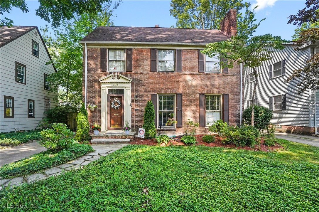 Beautiful Shaker Hts Brick Colonial with finished third floor and basement was hardwood floors that run throughout the top three floors. Oversized Living Room is accented with Crown Molding, bookcases the frame the gas Fireplace with decorative mantel and tiled hearth and windows with plantation shutters. The living room is an inviting space off the entry and opens to the formal dining room through archways. The dining room features a built in cabinet and double doors leading to the stone patio and lovely backyard. Bright Eat in Kitchen boasts wood ceiling, dining nook, pantry, appliances, recessed lights and plenty of counter spaces. Don't miss the half bathroom conveniently located near the side entrance. The second floor has a spacious primary bedroom with large closet and two additional bedrooms. One bedroom has a walk in closet that also leads to the back balcony area lined with rails overlooking the backyard. Full bathroom has tiled floor and partial walls plus granite vanity top. Third floor is a welcome bonus with another bedroom with generous closet spaces and a bonus area perfect for a home office or private lounge area. Finished basement offers additional living space with built in bookcase and tiled floor. Additional living space perfect for a recreation room, workout room and even a playroom. The other half of the basement has the laundry area with sink, washer and dryer plus plenty of storage areas. The backyard does not disappoint with landscaping, patio, partial privacy fencing and garage which is located towards the back of the yard to allow for a nice yard space. Neutral decor throughout the home with trim work and doors painted white. Many areas has crown molding accents and windows with plantation shutters. Tons of natural light and open hallways, this gem feels so welcoming. Located close to Van Aiken District, sidewalks, shopping, restaurants, more. Home will be violation free for new owner.