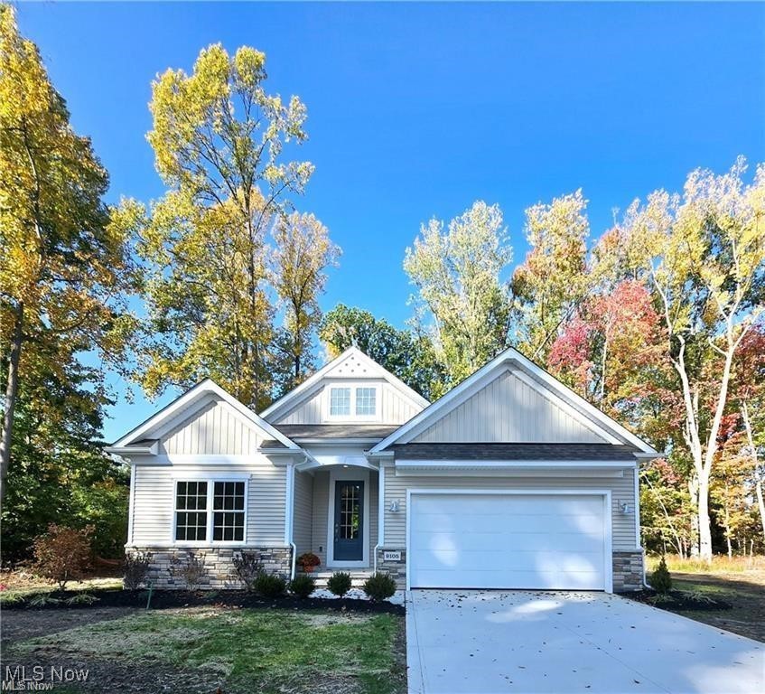 Experience the Spacious Elegance of the Tisbury Plan! Step into the inviting foyer where timeless design meets exceptional functionality. The grand entryway, highlighted by an open staircase, sets the tone for the quality craftsmanship throughout. At the front of the home, two generously sized bedrooms and a full bath offer flexibility that's ideal for guests, a home office, or a quiet study. The heart of the home is the open-concept kitchen, designed for the culinary enthusiast, featuring an expansive quartz island perfect for both meal preparation and entertaining. Custom cabinetry elegantly wraps around the island, providing abundant storage and a seamless flow into the adjoining great room. The great room is filled with natural light and anchored by a stunning tray ceiling and a custom fireplace, creating a warm and sophisticated gathering space. The main bedroom suite serves as a private retreat, complete with a luxurious bath featuring double vanities, a seamless tiled shower, and an impressive walk-in closet. Thoughtful details throughout include a first-floor laundry room with a custom drop-zone bench, as well as a conveniently placed broom closet. This home combines beauty with practicality at every turn. Discover the perfect blend of luxury, functionality, and tranquility in the Tisbury plan.