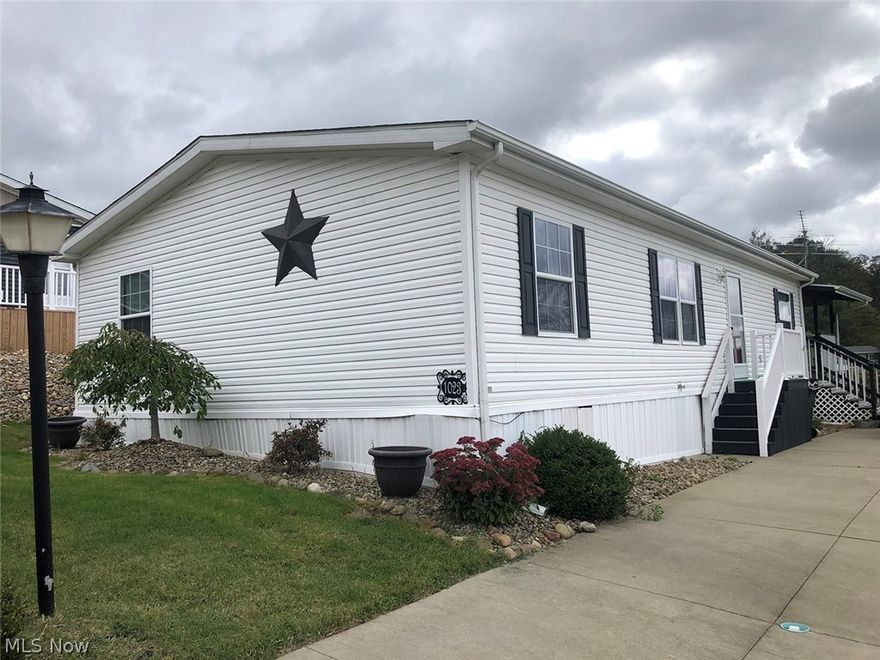 Well Maintained Arlington Manufactured Home, built in 2014 w/ 1,248 sqft. The main level features open concept living w/ large fully applianced kitchen including island, dining room, family room & laundry. Master bedroom w/ full bath offers privacy on one end of the home while two additional bedrooms and a full bath are located at the other end of the home. Spacious covered back deck w/ kitchenette is perfect for entertaining. Shed. Public utilities. Parcel #10006680. Quality manufactured home located in Fohl Village w/ great amenities including community pool, clubhouse, basketball courts, and much more!