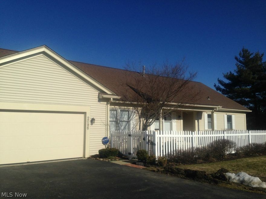 The living is easy in this 3 BR, 2 bath ranch located in Hudson's beautiful Fairway Homes Condominiums. Sun room is ready for year-round enjoyment with a Fujitsu heater and air conditioner providing comfort in all seasons. Hardwood floors in the eat-in kitchen and office/bedroom. Gas fireplace with beautifully detailed surround and built-in bookshelves provides warm ambiance in the living room, which adjoins the dining room complete with pass-through to eat-in kitchen. Living room, dining room, and sun room feature vaulted ceilings. Master suite with renovated bath. 2 additional BRs & full bath, or use 1 as den/office with built-in shelves. Large, full basement with a pool table that stays with the property; attached 2-car garage. Recently-installed Generac generator stays with the property. Tiled foyer leads out to beautiful front porch and fenced garden area.