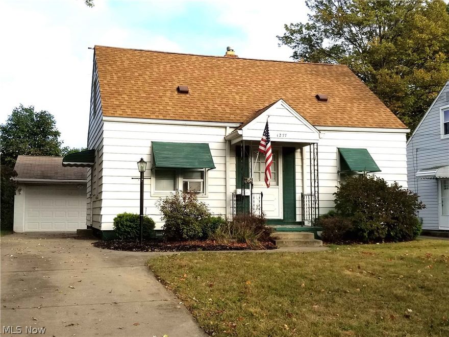 Great value in this 3 bedroom 1 bath North Akron cape. Hardwood floors throughout and updated newer windows. Eat in kitchen with sliding doors open up to back yard and newer 2.5 car garage. Living room, two bedrooms, and renovated full bath complete the main floor. Second floor could be master or large living space with extra closets. Partially finished basement with newer furnace. Roof is 2 years young with fully transferable warranty.