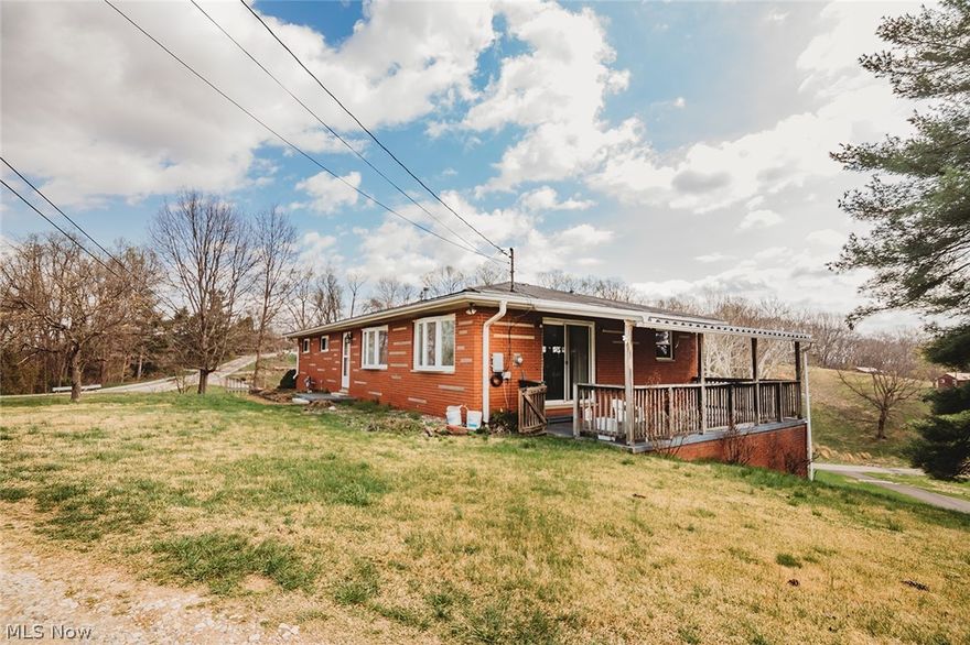 This Classic 3 Bedroom Ranch was built in 1967, with an unfinished, walkout lower level w/full bath and two car garage.  More recently, the lower level was redesigned for this current Sellers Mother's living area. It is complete with Living/sitting area, bedroom with generous closet and dining/kitchen combo and full bath. This area has a southerly window and exit door, opening onto a patio and back yard, as well as to the garage. Presently, all first floor rooms are carpeted, except the two bathrooms, kitchen and laundry room.  Seller noted there are original hardwood floors, beneath the carpeting.The Seller is considering having the carpeting removed.  18' x 12' deck off the dining area and 24' x 10' attached covered porch on right side of home. First floor bathrooms are functional, simply need to be refreshed.  Garage area is 29' x 25'. Room measurements are rounded up. This is an "As Is Home Sale." Call, Sue, or your Agent of choice, to view this inviting home!