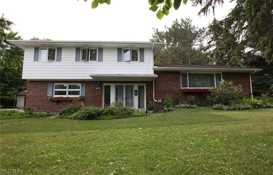 Custom built 4 bedroom home in Amherst Township on almost an acre lot! Home has so much to offer, original owners took such loving care.  Beautiful hardwood floors in all 4 bedrooms, great room and dining room.  All 4 bedrooms are a good size with good closet space.  The large upstairs bathroom has double sinks.  The main level offers a huge open great room, formal dining room with built in shelves and eat in kitchen with all appliances staying.  The lower level offers a foyer with double front doors, attached 2 car garage with door openers and a heater, family room, a full bathroom and glass sliders to a sun room with cable hook up, heater and ceiling fan for enjoying.  The basement has plenty of room for storage or extra play/workshop area, a separate fruit cellar, and washer and dryer stay as well. The yard offers 2 sheds, a paved driveway and many trees and flower beds. Walk to the back of the property and see the little creek. Roof was replaced within the last 5 years.  Call today