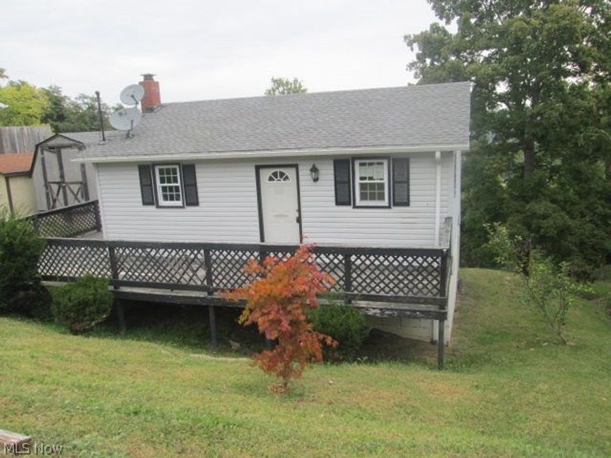 1 story home with  deck on the front of the home. The main floor has a living room and 2 bedrooms. Basement has kitchen, bathroom and a possible 3rd bedroom.  There is also a shed on the property.
