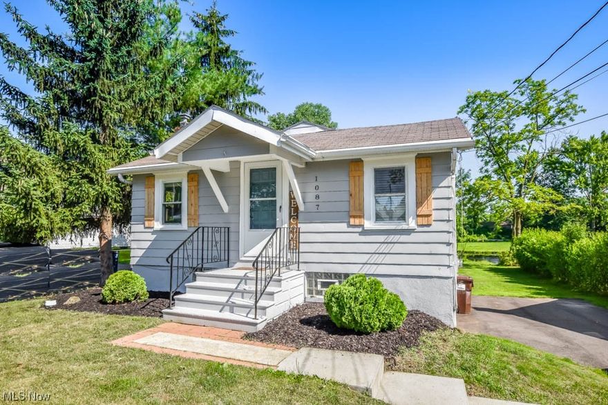 Absolutely adorable and well-maintained cottage style ranch with canal frontage! This easy-to-maintain charmer offers ample space and a delightful open layout. The living room sets a cozy tone with its electric fireplace and rustic wood plank wall surround. Connected to the living room is an eating ledge that seamlessly transitions into the kitchen, complete with a large farmhouse sink, tile backsplash, and matching white appliances. Down the hall, you'll find two bedrooms and a modern bathroom featuring a shower, pedestal sink, and shiplap paneled walls. The full unfinished basement houses the laundry area and provides convenient access to the backyard. Step outside to a deck overlooking the canal, where you can relax and take in the water view or enjoy activities like fishing or kayaking right from your own backyard! There's also a graveled fire pit for cozy evenings outdoors and a shed for all your storage needs.  Don't miss out on this affordable find, call to see it today!