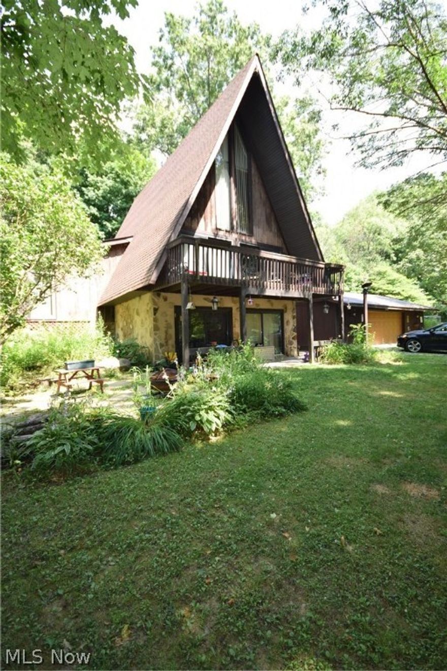 What an opportunity to live in complete privacy on a 7.3 acre property in a one of kind A frame! Awesome 2.5 story great room with patio doors to the deck. Master bedroom on the main floor features an attractive stone fireplace. Second bedroom on the main floor with full updated bathroom and kitchen/dining area completes the main floor. Second floor is one large bedroom with access to the 3 floor loft. Currently one room in the lower level is being used as a bedroom and there is potential for 2 more rooms. Large detached garage right next to the house and another large shed off the driveway. Lot is completely private and house can't be seen from the road. Don't miss out on this property. Call today to schedule your personal tour!