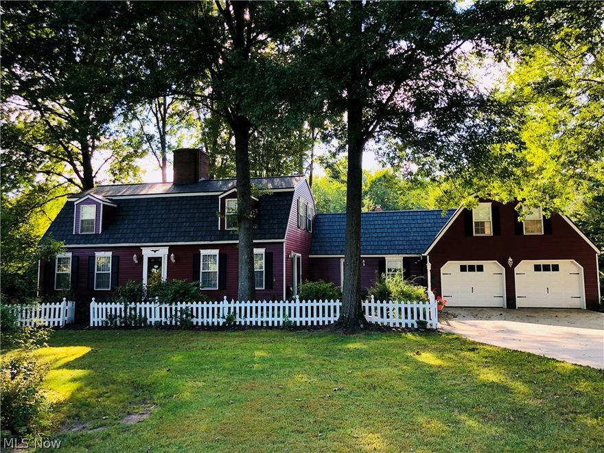 Dutch Colonial home situated on almost 10 beautiful secluded acres of mostly wooded land in Historic Westfield Center. This 4 bedroom, 3 1/2 bath home is minutes from I-71/ I-76. Special characteristics of this home includes a beautiful ( slate) metal roof with lifetime guarantee, Schrock cherry cabinets, quartz counter tops and wood floor in kitchen and a wood burning fireplace. Step out to a glass enclosed porch. Enjoy the family room with it's gas log fireplace. The formal dining room has hardwood floors and a crystal chandelier. The spacious living room has a gas log fireplace.This Home has an abundance of closet and storage space. All three bathrooms have been updated.  Waterproofed basement with a lifetime warranty transferable to new owner. Recently painted inside and outside.  30 by 30 barn also has a metal roof, 2 stalls and brick floor in part of it.  Horse permitted. Could be a great barn for the car collector. If you are looking for seclusion and love the woods you don't wa