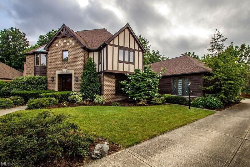 Welcome to this beautiful tudor colonial home situated on a very large, wooded lot in the desirable Country Club Estates community across from Lakewood Country Club. This gem has almost 4,400 square feet in living space with a 3+ car garage at the rear of the home. Upon entering the home, you will find a traditional floor plan with spacious rooms to compliment today's lifestyle. The home boasts of a formal living and dining room, a fantastic large home office and a back family room that spills into a bright sunroom and large deck. A great house for entertaining! The backyard is angled so that there is exceptional privacy and even room for a pool if desired. The basement is finished and includes a wet bar for additional entertaining space. Upstairs you will find the master bedroom and 3 large bedrooms, along with 3 full bathrooms. This house is priced to sell with your updates and finishing touches in mind. Do not miss the opportunity to buy in this exceptional community at such an amaz