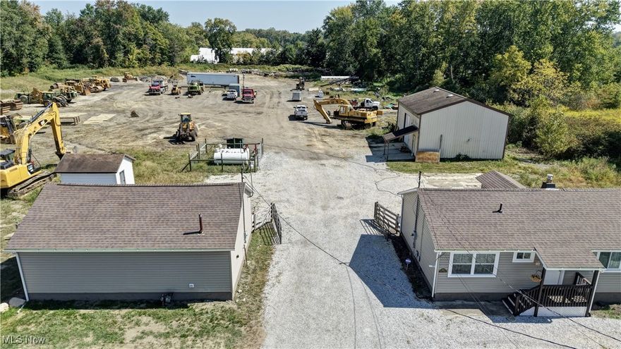 Just over 5 acres of Commercial property right on Barber Rd with remodeled office and storage buildings for all your needs. Close and convenient access to the highway. The office building and storage space as you enter have been completely updated less than 6 months ago. There is an additional 32x40 Outbuilding behind office for even more storage. Two main doors on office building, 12 foot dock doors on the storage buildings.