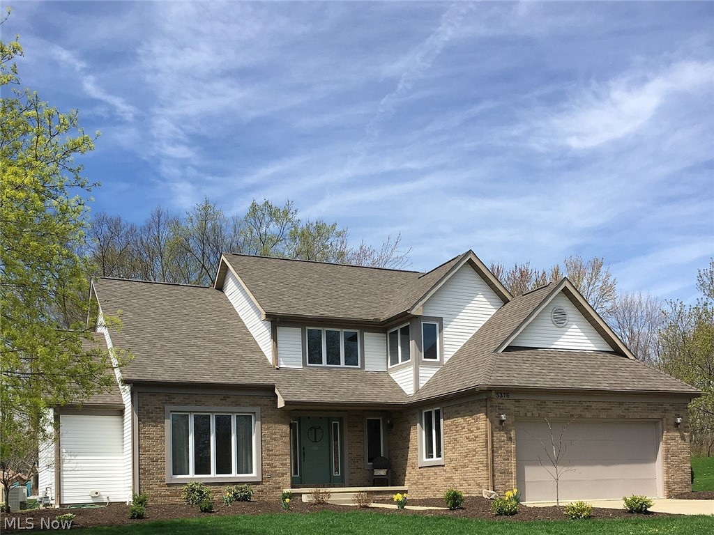 You will not want to miss this unique, custom built home in the Towbridge subdivision! Owners have made many updates over the past 3 years, including new roof (2019), new carpet, neutral paint, stacked stone fireplace, updated bathrooms, new backsplash and cabinet hardware, dishwasher, hot water tank, and water softener. This home features the hard-to-find first floor master bedroom, complete with a renovated en-suite bathroom and walk in closet. Upstairs, you will find three bedrooms, a full bathroom with double sinks, and a second floor laundry room. There is a beautiful playroom/family room in the basement as well as two unfinished rooms for storage. Home also has a central vacuum system for your convenience. Neighborhood is located close to bike/hike trails and CVNP and is very accessible to Route 8 for your morning commute.