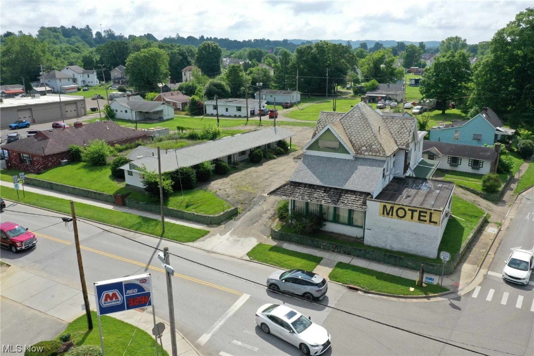 This prime Cambridge commercial property offers any number of interesting options for the investor with vision. One option would be razing the old motel and replacing it with a shiny new business. Senior living offers demand in Guernsey County, patio homes perhaps? Short term rentals or efficiency apartments would be a perfect fit or if a non profit organization is your demand the possibilities are endless. Another option would be reimagining the old motor lodge as a nostalgic ode to American road trips. After all, there is a hot national trend that's not slowing down of turning old motor lodges from yesteryear into chic boutique hotels of today. Whatever path the savvy investor chooses, this property has great potential with its inherently valuable location at US 22-40, the historic National Road at one of the gateways to the charming city of Cambridge. Auction scheduled for 8/24/23 at 5:30pm with an Open House 8/17/23 at 5pm. All bidders must be registered with proof of funds availab