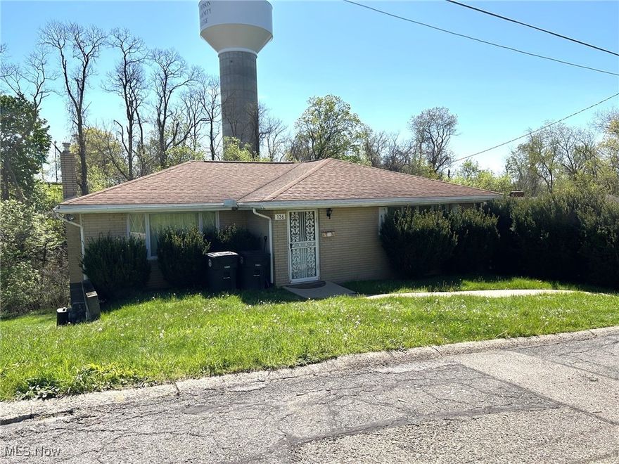 MID CENTURY MODERN 3 bedroom brick ranch,  includes, an additional parcel sitting on a quiet dead end street in Steubenville's West end.  Main level consists of living room, formal dining room , eat in kitchen,3 bedrooms, and full bath. Kitchen door leads to a deck overlooking the back yard.  Per a family member the home has hardwood floors , original Anderson windows and an approximately 10 year old roof.  Lower level has a full bath, laundry area, plenty of storage, and walkout to back yard.
HOME IS SELLING "AS IS".  THIS IS AN ESTATE & NO REPAIRS WILL BE DONE.
