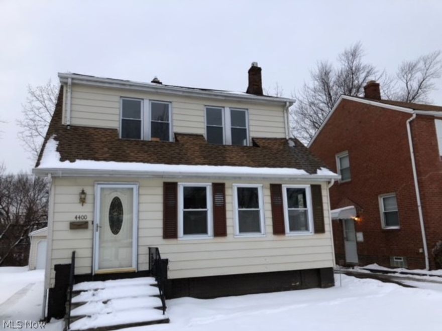 HOT BUY!!!! Great for an investor or home buyer. VIOLATION FREE!!! This Warrensville Heights Colonial features an enclosed front porch and a large back deck ideal for entertaining.  Property has been updated and has new carpeting upstairs, new kitchen flooring, new dining room flooring, refinished hardwood floors, updated electrical, updated plumbing, new garage door, new fixtures throughout home, new kitchen counters, and freshly painted. The New French Doors adds an accent leading to the dining / living room!!!  This 3 bedroom, 1.5 bath Colonial is ready for a tenant or home buyer. The rooms are HUGE!  A MUST SEE! A great PORTFOLIO BUILDER!!!! Schedule your private showing ASAP, priced to MOVE FAST!!!!