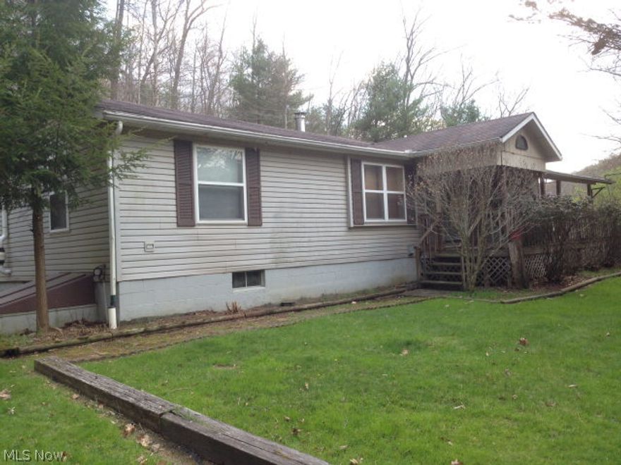 Secluded 3 bedroom, 2 full bath modular on 7.113 wooded acres. Full basement. 1st floor laundry. Living room with fireplace. Attached 2 car garage.