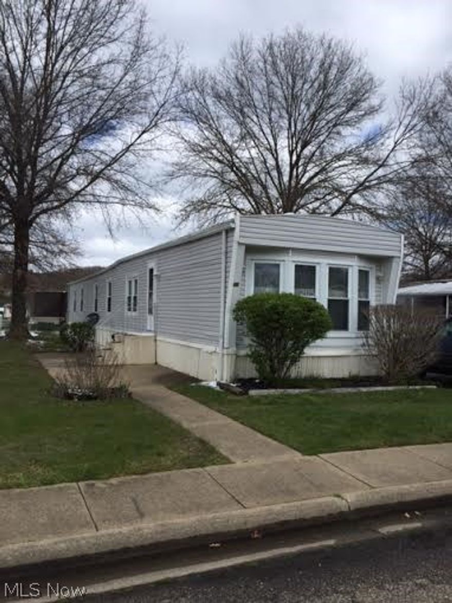 Pride of ownership with this 3 bedroom, 2 bathroom modular at Shelmar Estates.   The large kitchen includes a nice snack bar, and lots of windows.  Stove stays.  The living room has a 12 x 7 pull out to expand the additional living space.  The master bedroom includes a master bathroom with his and her sinks, a shower, and a garden tub.  Laundry room.  Lot rent is $315.17.