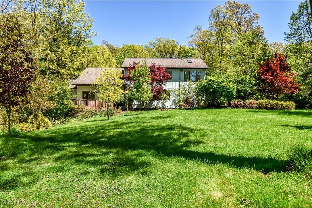 Welcome to this one-of-a-kind architectural gem! This beautifully crafted home blends modern design with timeless character, set on a private, wooded lot that offers peace, privacy, and natural beauty in every direction. Step inside to the soaring ceilings, exposed beams, and an open-concept layout flooded with natural light. The spacious living areas features a striking stone fireplace, over sized windows, and unique woodwork that adds warmth and personality. The heart of the home is the custom-designed kitchen, thoughtfully updated with high end cabinetry, premium finishes, and a layout perfect for both everyday living and entertaining. The first floor offers a spacious first floor master with custom built in cabinets and shelves for unlimited storage in the master closet. Don't miss this rare opportunity to own a custom home that stands apart from the rest. Schedule your private showing today!