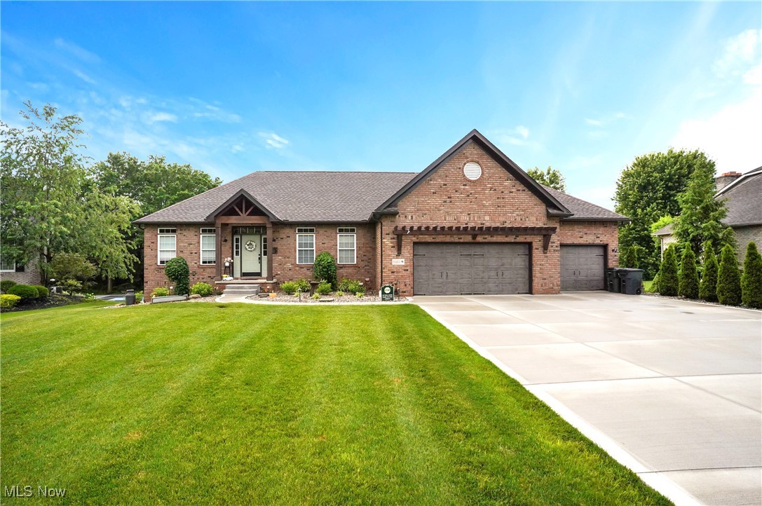 Discover your dream home in the sought after Louisville School District! This completely updated 5 bedroom residence boasts a host of modern upgrades both inside and out! Step onto the new, wider driveway and sidewalk, leading to a meticulously new landscaped yard with Lesco Hydro seed, 21 trees and 40 plants. Enjoy the outdoors with updated lighting, a Rain Bird sprinkler system with a convenient phone app, a charming garden, and a cozy fire pit. The front porch has been transformed with cedar beams and a pergola over the garage. Inside, every room has been thoughtfully reimagined. Experience the elegance of Mannington flooring, updated lighting and fans, detailed woodwork, and a stylish updated mantel with a gas fireplace. The kitchen shines with refaced Kraftmaid oak cabinets, Corian countertops, GE Cafe appliances, a stainless steel farmhouse sink, and a new slider leading to a peaceful deck.The first floor master suite features crown molding, a custom closet with garage access, and a completely new master bath with a jetted tub, shower, updated cabinetry, sinks, lighting, flooring, and toilet. Upstairs, find two generously sized bedrooms, one ideal as an office, and an updated main bathroom. Convenience abounds with a new mudroom/laundry room off the garage, featuring new washer/dryer, a washtub with a Kraus faucet, and a large landing. The three-car garage includes a gas heater and keyless entry. The lower level offers new wood stair treads, an added bedroom, updated flooring, a full bathroom, a kitchenette, a workout room, and ample storage. A slider opens to a private setting with an outdoor fireplace. Mechanically, this home includes an all new gas tankless hot water heater, a reverse osmosis drinking water filtration system, a serviced air conditioner and furnace with a new blower motor, and a whole-home water filter. This one truly has it all don't miss your chance to own this beautifully updated property, schedule your showing today!