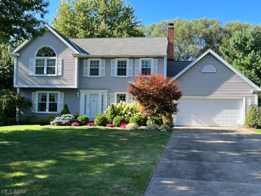 Welcome to this stunning, move-in ready home in sought after Solon. This classic center hall colonial is superbly maintained offering an abundance of beauty inside and outside.  The home boasts a beautifully appointed kitchen with poly-stone counters, ceramic floors, center island, built-in buffet in dinette, and updated lighting. Kitchen cabinets and beams professionally painted including new hardware installed in 2016. A large family room in addition to a separate living room adds to your choices for entertaining.  The second floor has 4 generously sized bedrooms including a large owner's suite complete with an ensuite.  An additional full bathroom completes the second floor layout.  The lower level has 1020 sq ft of finished basement complete with an additional full bath and an abounding amount of storage.  The windows on the first and second floor (excluding the sliding glass door) were replaced in 2013. Furnace and A/C were replaced in 2022.   Enjoy entertaining on the large deck