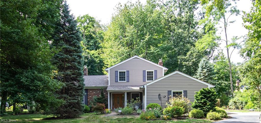 Welcome home to this fabulous 3 bedroom, 2.5 bath Lake Rd home on almost an acre of wooded park-like land! No renovations to do here, just move in and enjoy! Private 1st floor office with built in cabinetry, spacious living room open to the dining room and Kitchen. The absolutely stunning gourmet kitchen (remodeled in 2016) features Amish made cabinetry, SS appliances, gas range, granite counter tops, tile backsplash, prep sink, breakfast bar, and sky light. The family room off the kitchen includes a cozy fireplace (new liner, doors, and stone refacing 2017) and sliding glass doors leading to the fabulous 3 season/sunroom overlooking the backyard. Upstairs you will find all 3 bedrooms including the spacious primary bedroom with private en suite bath and double closets. Second full bath located in the hall. Lower level is perfect for storage and is where the laundry is located. Out back there is a paver patio, fire pit and large outbuilding/shed (new 2018) featuring an adorable covered