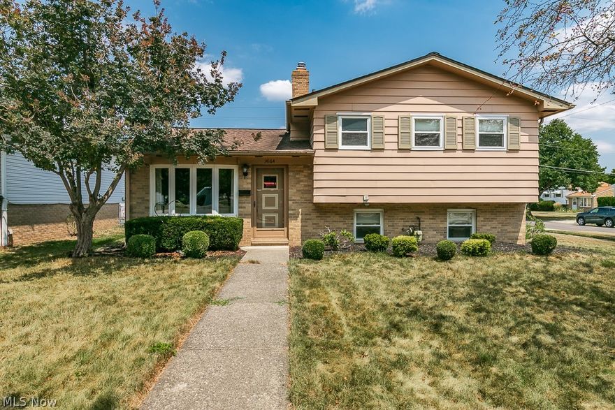 Welcome to 14164 Sheldon Rd in Brook Park! This well maintained split level home has been loved by the same family since 1984! The best properties to buy! It blends classic charm with modern comforts, making it perfect for your family.

Inside, the spacious living areas feel warm and inviting. The lower level has mid-century built-ins, a half bath, and plenty of room for everyone to gather. On the main level, vaulted ceilings with an exposed beam and a large bay window create a bright and airy living room. The open kitchen and living room layout is great for hosting family and friends. A glass sliding door in the updated eat-in kitchen extends the entertaining space to a patio and fully fenced backyard. Do not overlook the convenience of the oversized attached two car garage, a rarity for the area! 

Upstairs, three nice sized bedrooms with double closets share a full bath with an extended vanity and plenty of storage space.

Nestled in an established neighborhood, walking distance to the Metro Parks and served by Berea City schools, this is a home where memories are made.  Schedule your showing today!