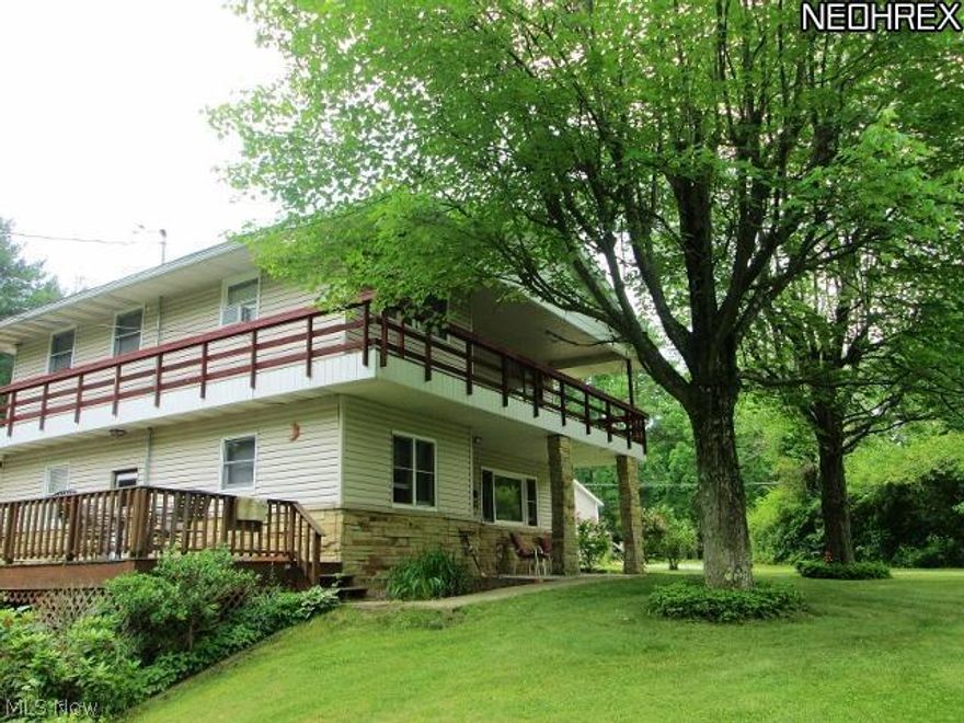 MOTIVATED SELLER Just in time to enjoy the summer...this 3 bedroom, 3 bath lake view home, less than 300' from the lake shore, sits on a beautiful 100x100 lot nestled in the quaint community of Atwood Village. This home is on private land, so NO LEASE. A quality dock incl. 2 slips is in a magnificent setting w/ easy access from your front door as is the community beach viewed from the deck. The 1st floor incl. living room w/ fireplace, kitchen, bedroom & full bath. The upper level offers a large mstr bedroom, a 3rd bedroom, family room w/ fireplace & a full bath. Also on this level is a wet bar, 2 sets of patio doors & a full wrap around deck. The finished walk out basement offers options such as a rec room & a 3rd bath. A two car oversized garage offers convenience & storage. Great home for entertaining with all the common space incl. a large 32x12 deck. This is a charming vacation home but is also ready for year round living.  Newer upper level floor coverings & new water softener.