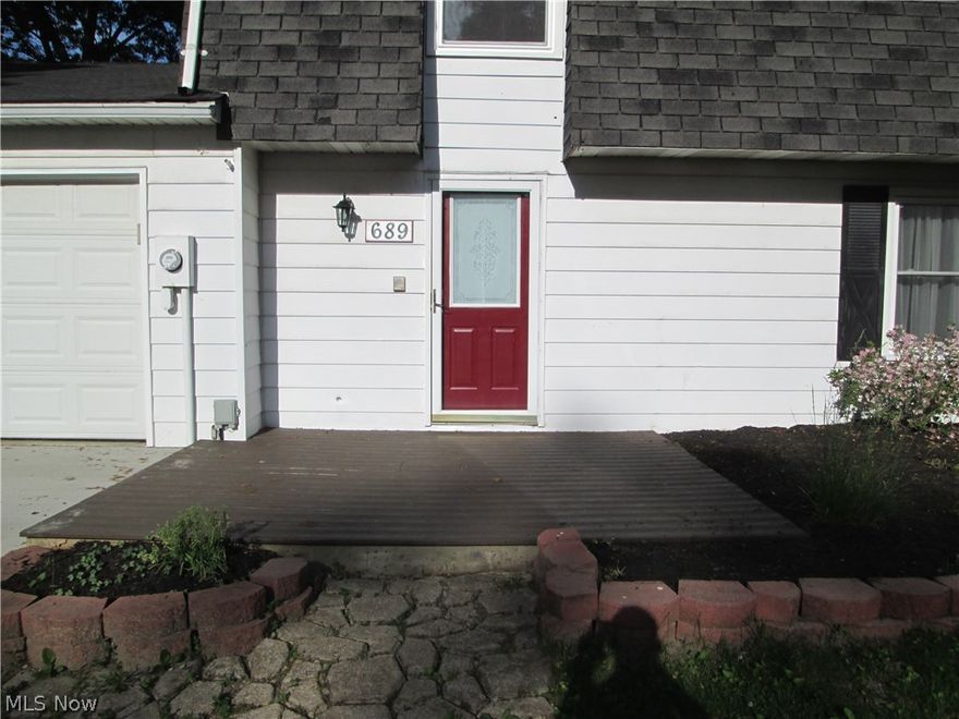 Wow! Beautifully remodeled colonial on a large .30 acre wooded lot with large 24'X24' outbuilding.  Attention to detail, quality, neutral decor, and charm throughout.  Brand new kitchen has white cabinets, new counter tops with beveled edges, black deep porcelain sink, matching black Frigidaire appliances, built-in dishwasher, built-in microwave, and smooth top stove.  New laminate hardwood floors look beautiful and elegant in the Kitchen, dining room, first floor laundry, and first floor bath.  Classy, white brick fireplace with bookshelf lighting, stylish oak mantle and new plush carpet in the living room.  All new plush carpet in all 3 bedrooms, hallway and stairs.  The roomy 17X12 master bedroom includes its own master suite bath, completely updated with a widespread 5'X3' walk-in shower, and new vanity, fixtures, and accessories.  Equally spacious second bedroom with double closets.  Graceful first floor laundry room off the garage entry with updated half bath for convenience.  Ne