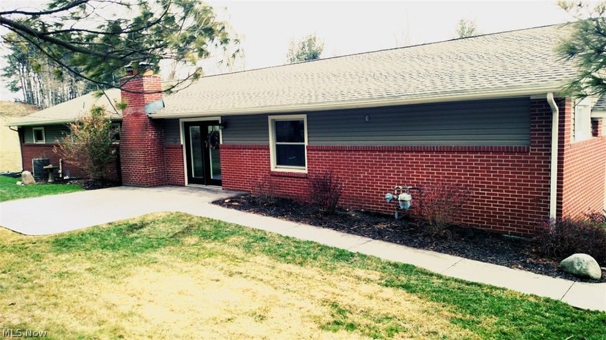 Welcome to 3113 State Route 516 NW, Dover, OH  44622!  This gorgeous 3 bedroom 3 full bath home is nestled amongst the trees, set on a spectacular view on a little over an acre of land and features large open rooms, beautiful oak kitchen, great for entertaining as it opens to a huge dining and social area, hardwood floors, a fully finished basement with play area, lounge area, and bar, and tons of storage! Nice utility building, attached 2 car garage, stained walkway and charming back patio area, apple,peach, and pear trees, and comes with 2 wells, 1 for interior and 1 for exterior, so there is plenty of water supply! Many more features make this home one worth seeing today!