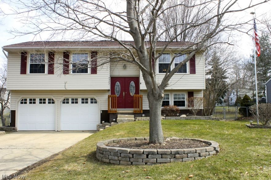Welcome to new paint and carpeting in this pristine bi-level with amazing curb appeal in Stow's Maplewood Park! Stainless kitchen, both baths with ceramic, fully fenced yard and bi-level deck for entertaining and paver stone landscaping work (including firepit) surrounding the exterior, roof (2007) ... just a few of the fine qualities you will discover here! You will also find replacement windows, newer front entry & garage doors, updated wood stair railing w/ built-in safety gate, a radon mitigation system (2009), a HUGE lower level family room with half bath and lots of cheerful light throughout! Updated electric panel in 2013. The ventless Vermont Castings gas stove downstairs can provide heat in case of power outage in the winter months. Close to Stow shopping, restaurants, library yet tucked away from traffic. So much to love!  Improvements too numerous to list them all here. You'll want to pick up the full listing when you visit the property! All of this and a one-year home warra
