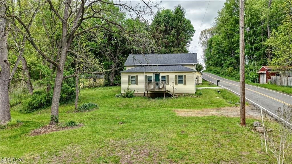 Are you looking for affordable living outside of town? Look no further! This home sits on 2.25 acres in between Beach City and Bolivar. The home features 3 bedroom 1 bath. In addition to the home and the land it also includes sheds for extra storage. On the first floor you will find the kitchen, living room, bedroom, foyer, and bath. On the second floor is two walk through bedrooms.
