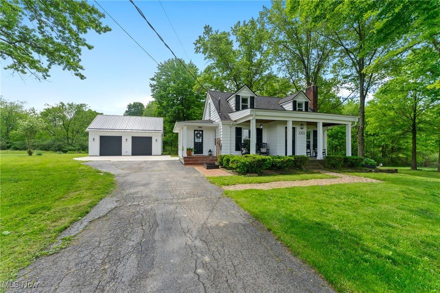 This charming fully updated 2-3 bed, 1.5 bath Canfield home is move-in ready and waiting for you! Sitting on just over an acre this charming home welcomes you into a cozy living room with fireplace and beautiful hardwood floors. From the living room is the formal dining room with built-ins that also connects to the eat-in kitchen. The kitchen boasts white cabinets, stainless appliances, updated backsplash, and desk space. Down the hall you’ll find the updated full bathroom with new vanity and tiled shower and the largest bedroom/bonus room! This room has private access via French door to the partially covered back deck that overlooks the gorgeous backyard with firepit area. The second floor of this home offers 2 bedrooms and a half bath. The waterproofed basement features walk-out and has been updated with a new sump pump with backup battery and wifi connectivity, glass block windows with vents, recessed LED canned lighting, farmhouse mop sink, and HWT. The icing on the cake is the brand new 32x28 garage with 12 foot ceilings with 100 amp service, 30 amp RV outlet and metal roof. Garage doors are 10x10 with shaft drive garage door openers with wifi! Additional updates include: light fixtures, front fence, landscaping with Green Giant privacy trees, concrete apron, roof/gutters/soffits (2023), porch slope, French drain, electrical panel 200 amp (house), Gordon Bros reverse osmosis water system, septic (2022), deck/patio (2022), windows (2020/2024), AC (2022). A one year home warranty is included for your worry free purchase! Schedule your private showing today!